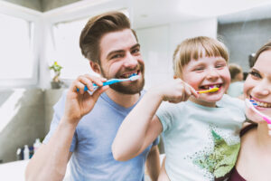 Daughters Parents Brushing Teeth