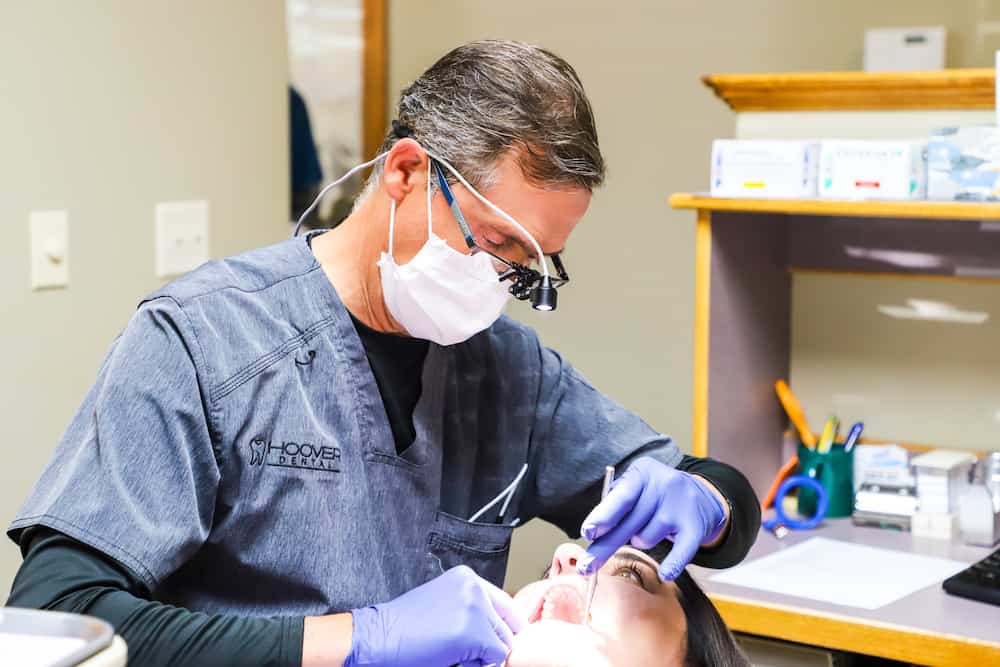 Dr Hoover Performing Root Canal Treatment With A Female Patient