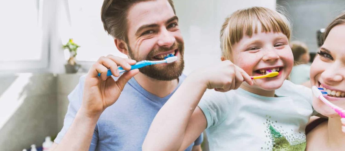 Daughters Parents Brushing Teeth