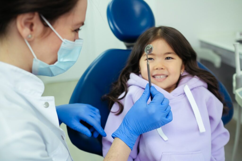 Pediatric Dentist With Young Patient